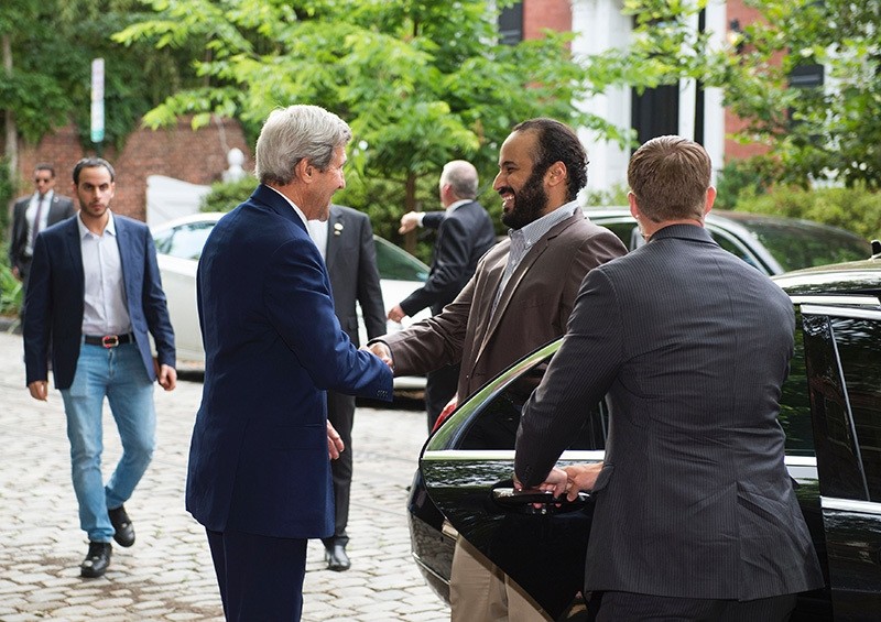 US Secretary of State John Kerry (L) greets Saudi Deputy Crown Prince Mohammed bin Salman outside Kerry's residence prior to their meeting on June 13, 2016, in Washington, DC. (AFP)