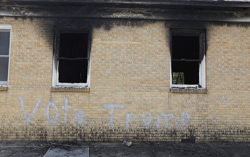,Vote Trump, is spray painted on the side of the fire damaged Hopewell M.B. Baptist Church in Greenville, Mississippi on Nov. 2, 2016. (AP Photo)