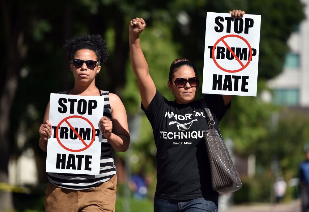 Two women arriving at a protest near where Republican presidential candidate Donald Trump will speak at a rally in Fresno, California on May 27, 2016.
