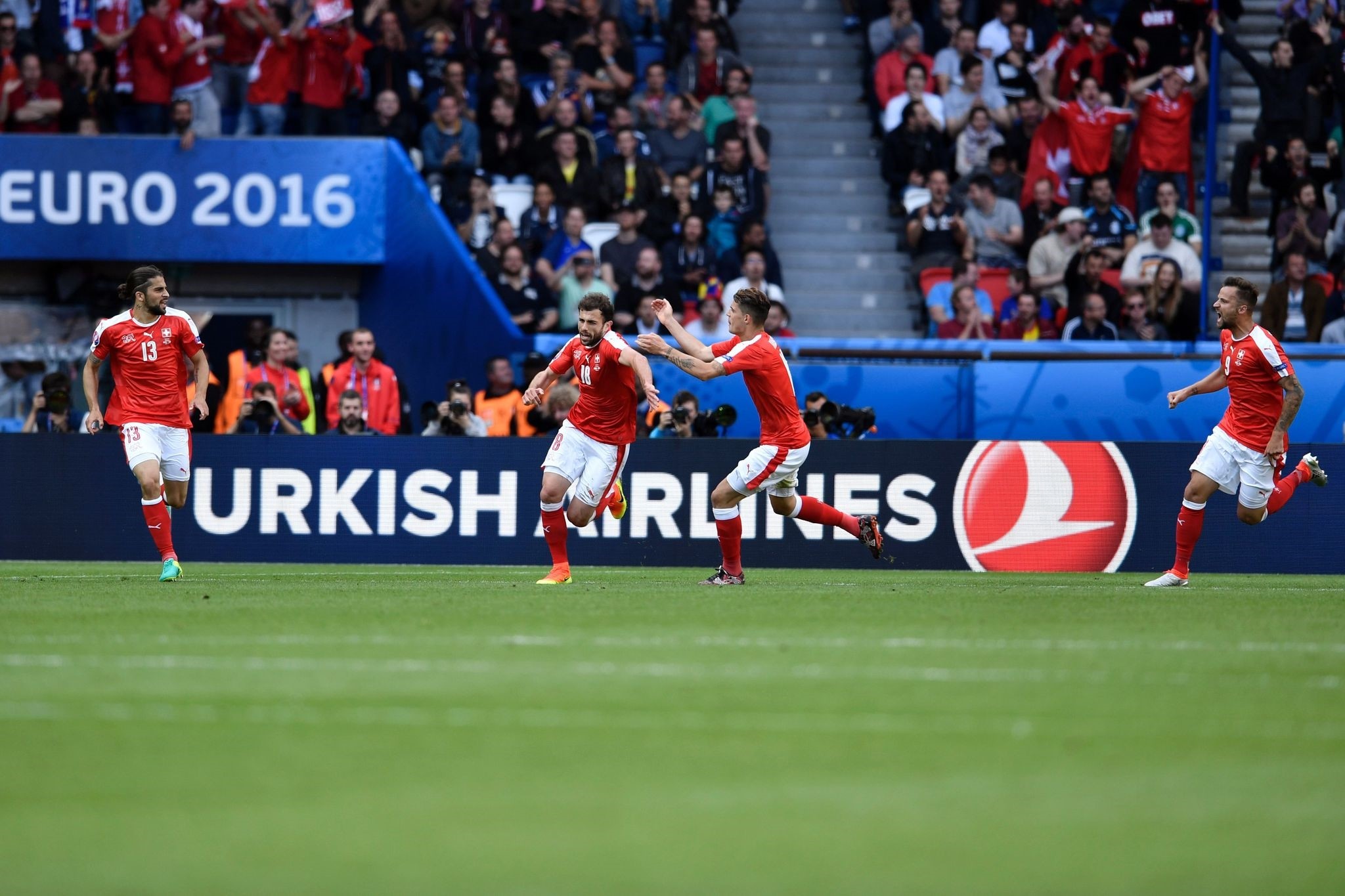 Swiss players celebrate the goal of Switzerland's forward Admir Mehmedi (2nd L) during the Euro 2016 group A football match with Romania. (AFP Photo)