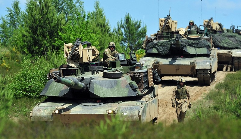 Tanks drive past during the Polish-led multinational exercise Anakonda 2016 at the training ground Drawsko Pomorskie, north-western Poland, 04 June 2016 (EPA Photo)