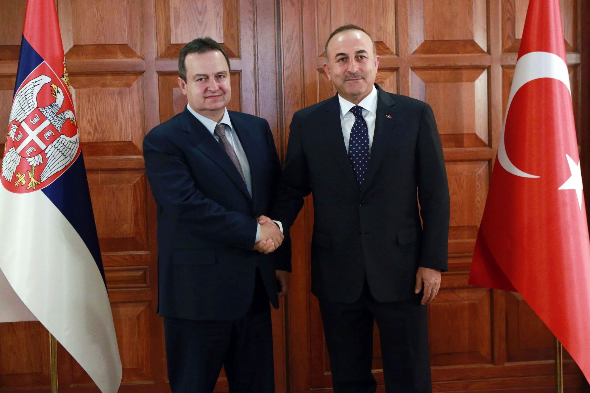 Foreign Minister u00c7avuu015fou011flu (R) shakes hands with Serbian counterpart Dacic in Ankara, October 5, 2016. (AFP Photo)