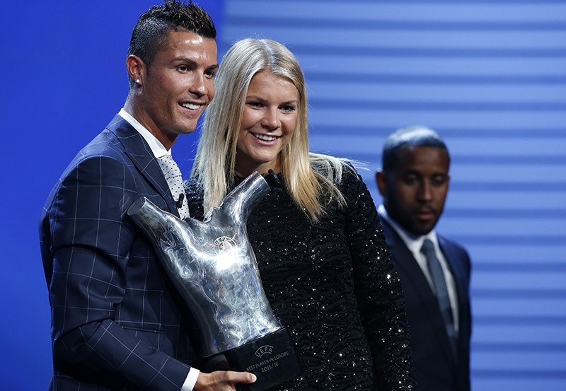 Cristiano Ronaldo of Real Madrid (L), UEFA's Best Player in Europe 2015/2016 poses with Norwegian player Ada Hegerberg of Olympique Lyon (R) UEFA's Best Women's Player in Europe 2015/2016. 