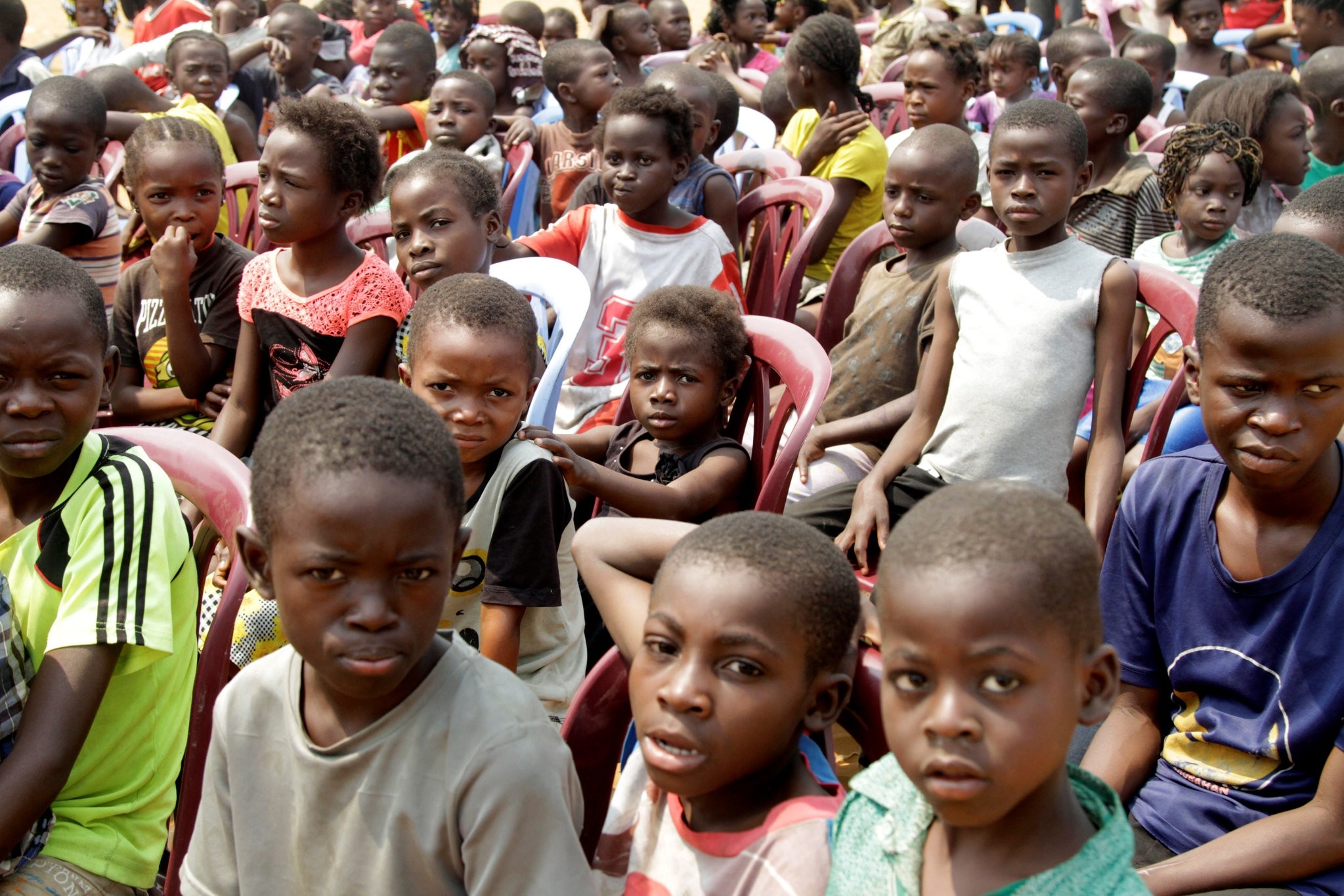 Congolese children gather at a soccer pitch as they await to be vaccinated. (Reuters Photo)