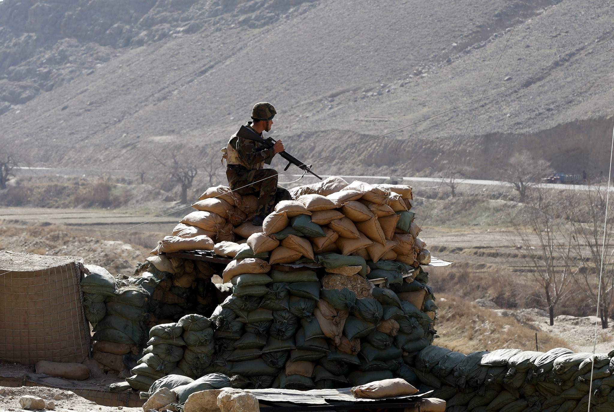 An Afghan National Army (ANA) soldier keeps watch at a checkpost in Logar province, Afghanistan, Feb. 16, 2016. (REUTERS Photo)
