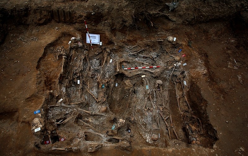 The remains of bodies are seen during the exhumation of the one of the three mass graves that contain in total the remains of around 200 bodies believed to have been killed by Spain's late dictator (Reuters Photo)