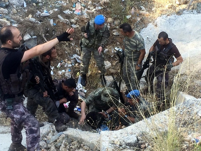 Security forces check a culvert where fugitive pro-coup soldiers were hiding in Marmaris, western Turkey, July 25. (AA Photo)
