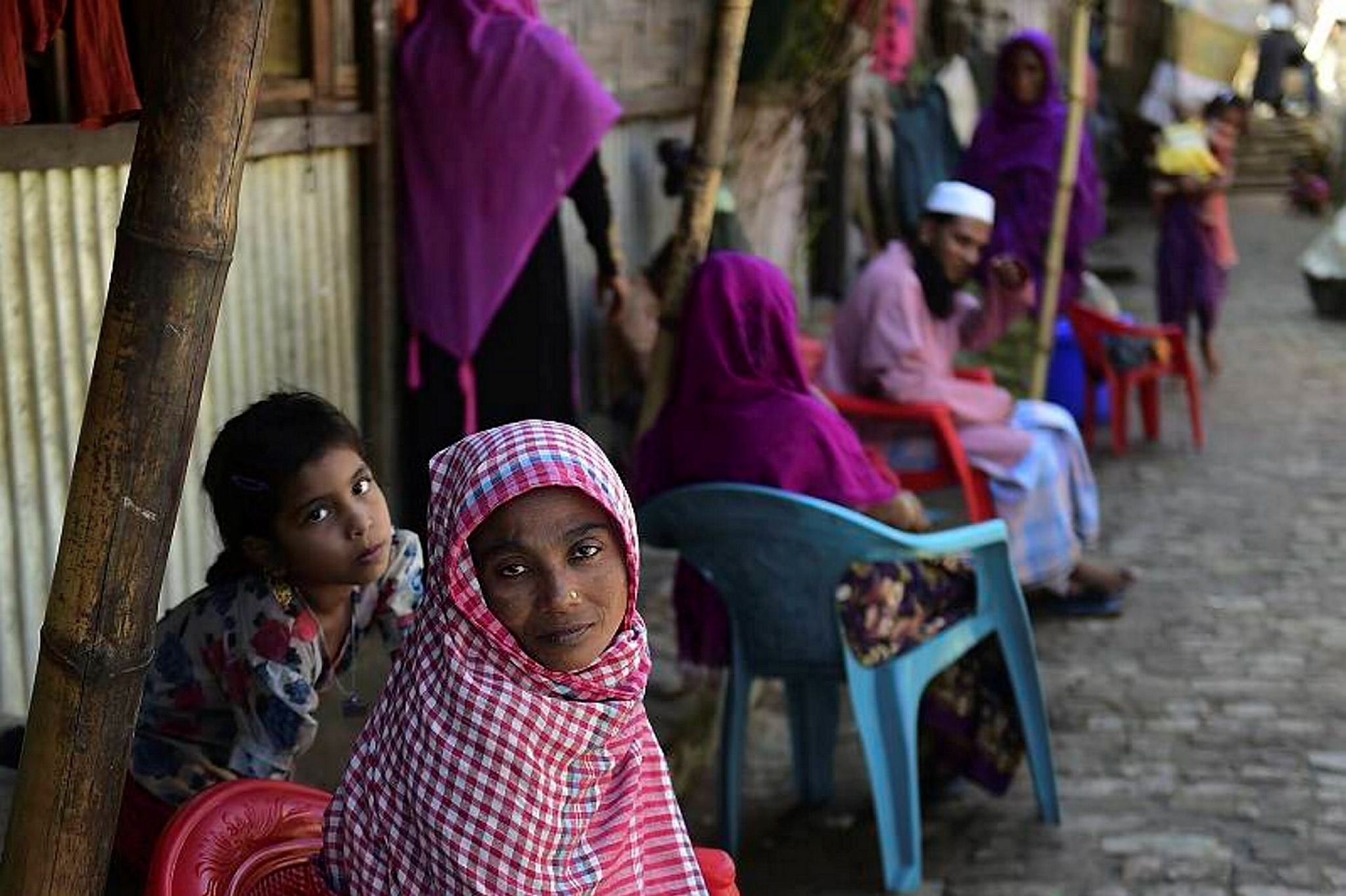 Rohingya refugees look on in a refugee camp in Teknaf, in Bangladeshu2019s Coxu2019s Bazar.