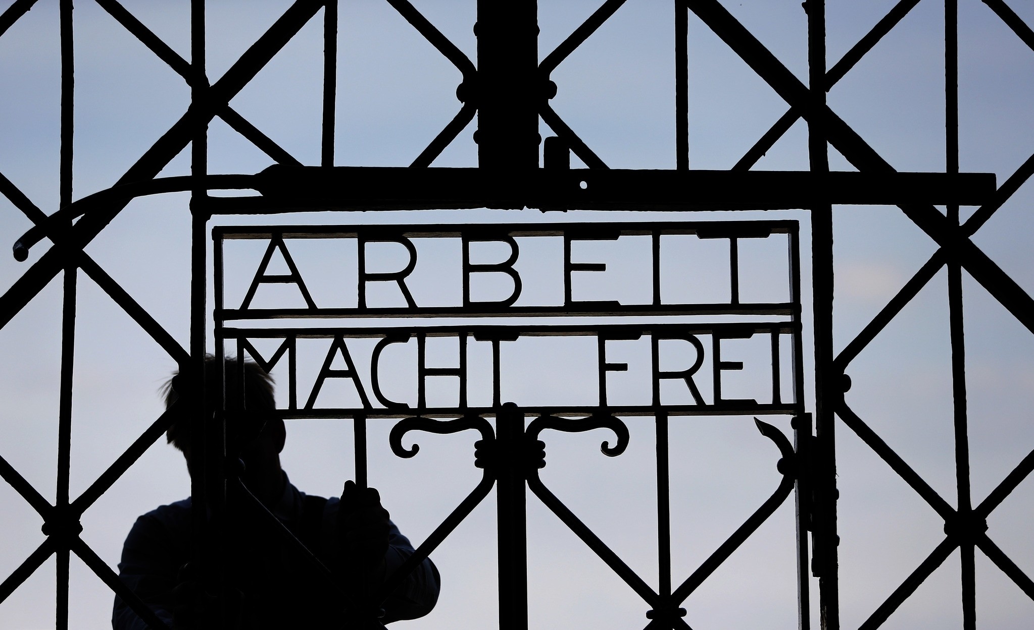 In this April 29, 2015 file picture a blacksmith prepares a replica of the Dachau Nazi concentration camp gate, with the writing ,Arbeit macht frei, (Work Sets you Free) (AP Photo)