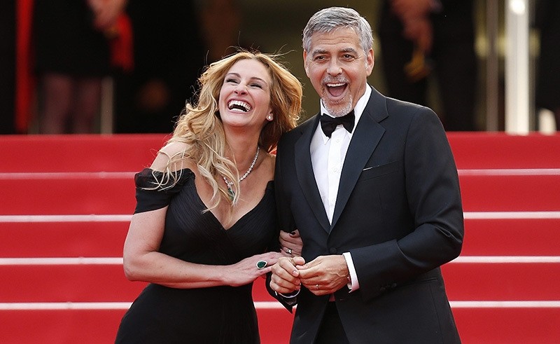 US actress Julia Roberts (Left) and US actor George Clooney (Right) arrive for the screening of 'Money Monster' during the 69th annual Cannes Film Festival, in Cannes, France, 12 May 2016. (EPA Photo)