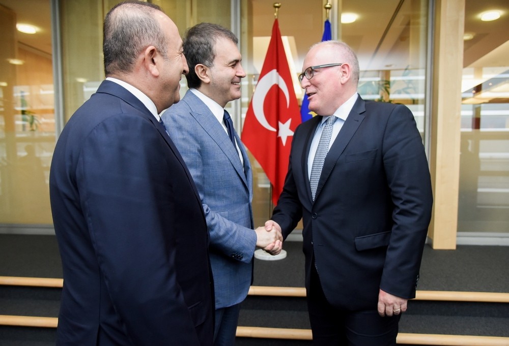 EU Minister u00c7elik (C) and Foreign Minister u00c7avuu015fou011flu (L) were in Brussels on June 30 to attend meetings with EU authorities.