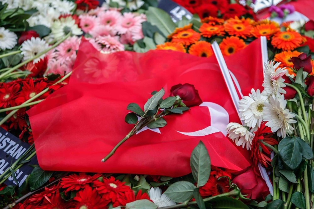Locals paid tribute to the victims of the recent terror attack in Beu015fiktau015f by leaving flowers and Turkish flags at the scene.