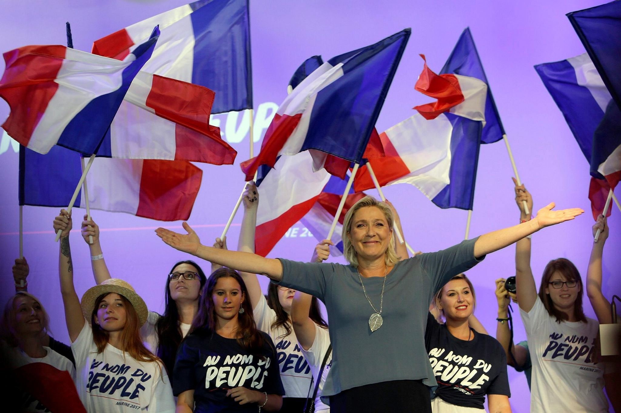 France's far-right National Front president Marine Le Pen waves to supporters during a summer meeting in Frejus, southern France.