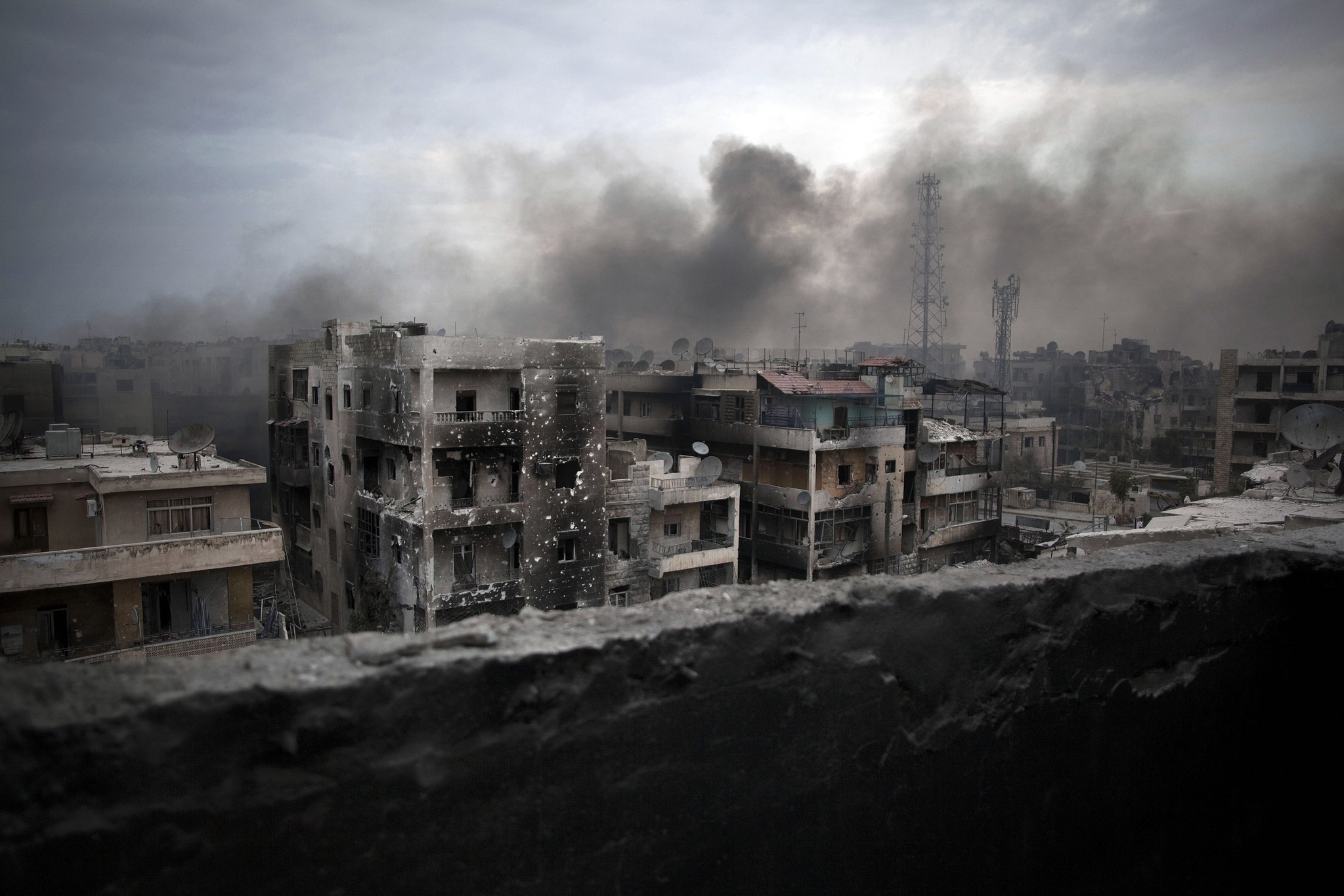 In this Oct. 2, 2012 file photo, smoke rises over Saif Al Dawla district, in Aleppo, Syria. (AP Photo)