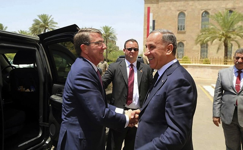 Visiting U.S. Defense Secretary Ash Carter, left, shakes hands with Iraqi Defense Minister Khaled al-Obeidi at the Ministry of Defense, Baghdad, Iraq, Monday, July 11, 2016 (AP Photo)