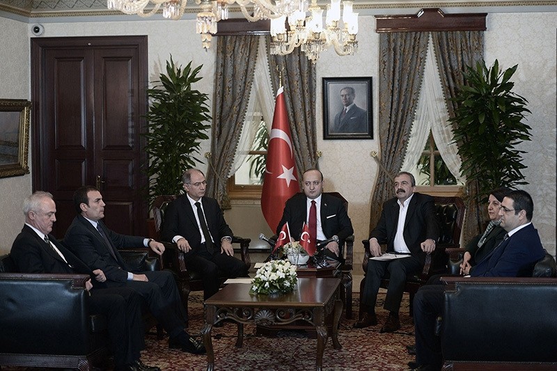 Ex-Deputy PM Yalu00e7u0131n Akdou011fan (C), accompanied by Interior Min. Efkan Ala (3rd L) meets with Peoples' Democratic Party (HDP) MP Su0131rru0131 Su00fcreyya u00d6nder (3rd R), Pervin Buldan (2nd R) and u0130dris Baluken (R) in Istanbul, Feb. 28, 2015. (Reuters Photo)