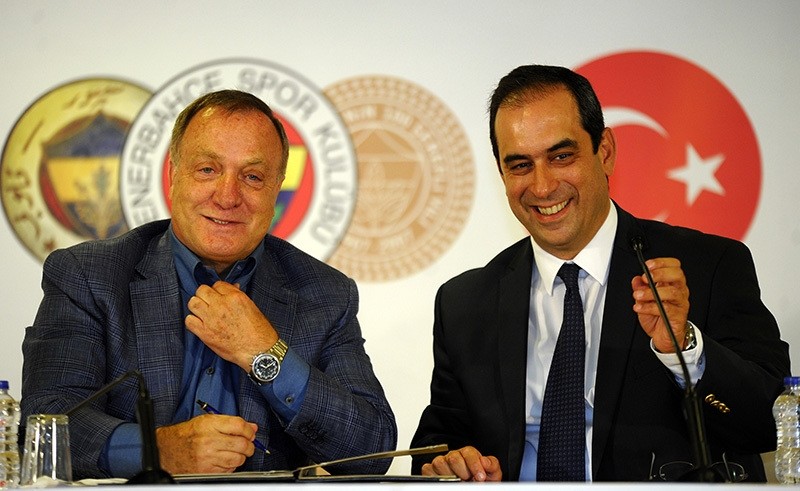 Dutch manager Dick Advocaat (L) poses with Fenerbahu00e7e's vice president u015eekip Mosturou011flu (R) during the signing ceremony in Fenerbahu00e7e u015eu00fckru00fc Sarau00e7ou011flu Stadium, Istanbul, Aug 17, 2016. (IHA Photo)