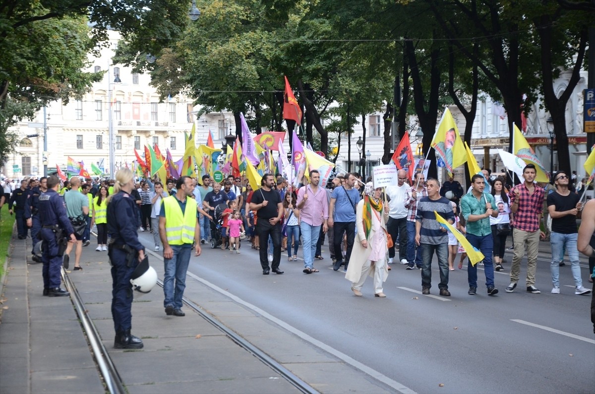 A group of PKK supporters march in central Vienna with the group's banners and the jailed leader Abdullah u00d6calan's pictures