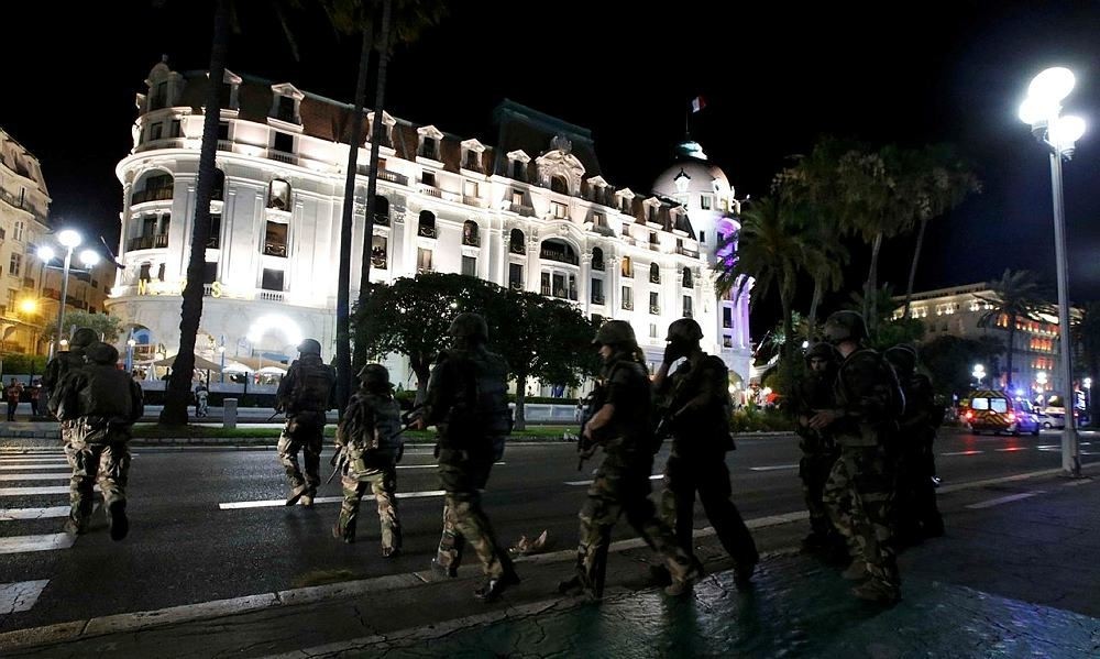 French soldiers advance on the street after at least 30 people were killed in Nice, France, when a truck ran into a crowd celebrating the Bastille Day national holiday July 14, 2016. (Reuters Photo)