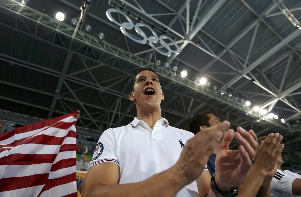 Mark Lopez cheers on his brother Steven Lopez of the U.S. 