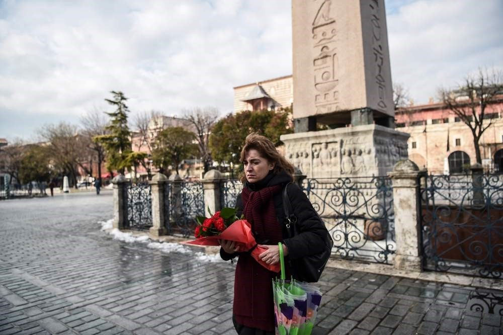 Sibel u015eatu0131rou011flu, Turkish tour guide who survived the attack, stood alone at the blast site yesterday before laying flowers in memory of victims.