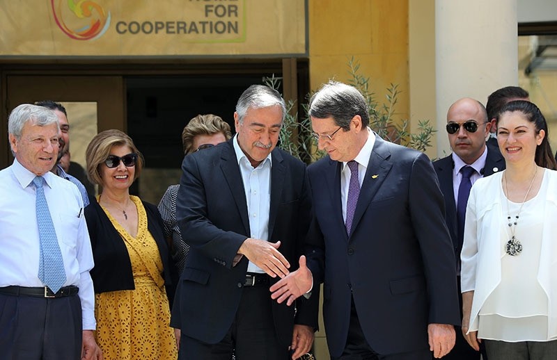Turkish Cypriot President Mustafa Aku0131ncu0131 (L) with Greek Cypriot President Nicos Anastasiades (R) at a bicommunal event organized by the Technical Education Commission in Nicosia (EPA Photo)