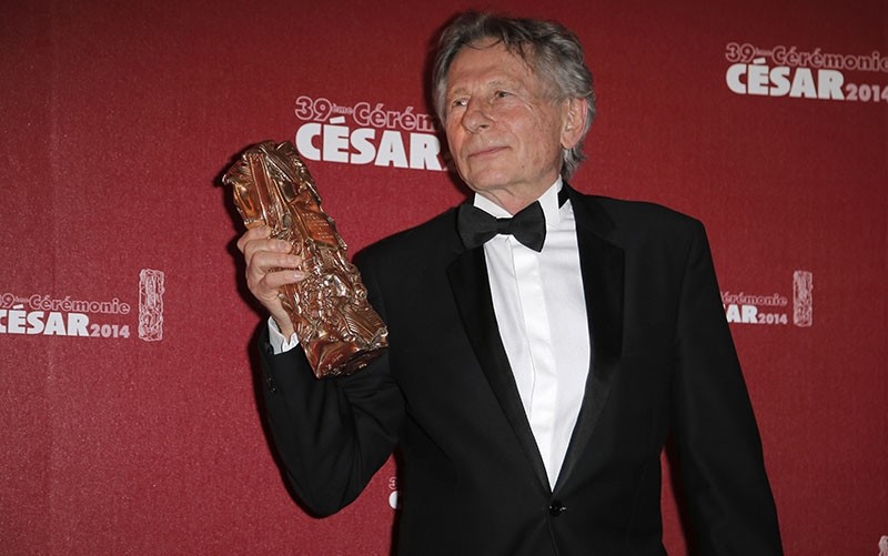 In this Friday Feb. 28, 2014 file picture, Polish-French film director Roman Polanski holds his best director award during the 39th French Cesar Awards Ceremony in Paris, France. (AP Photo)