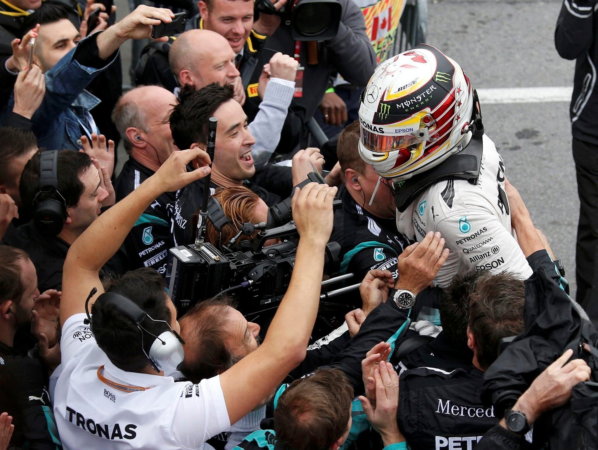  Mercedes driver Lewis Hamilton celebrates winning the race. (REUTERS Photo)