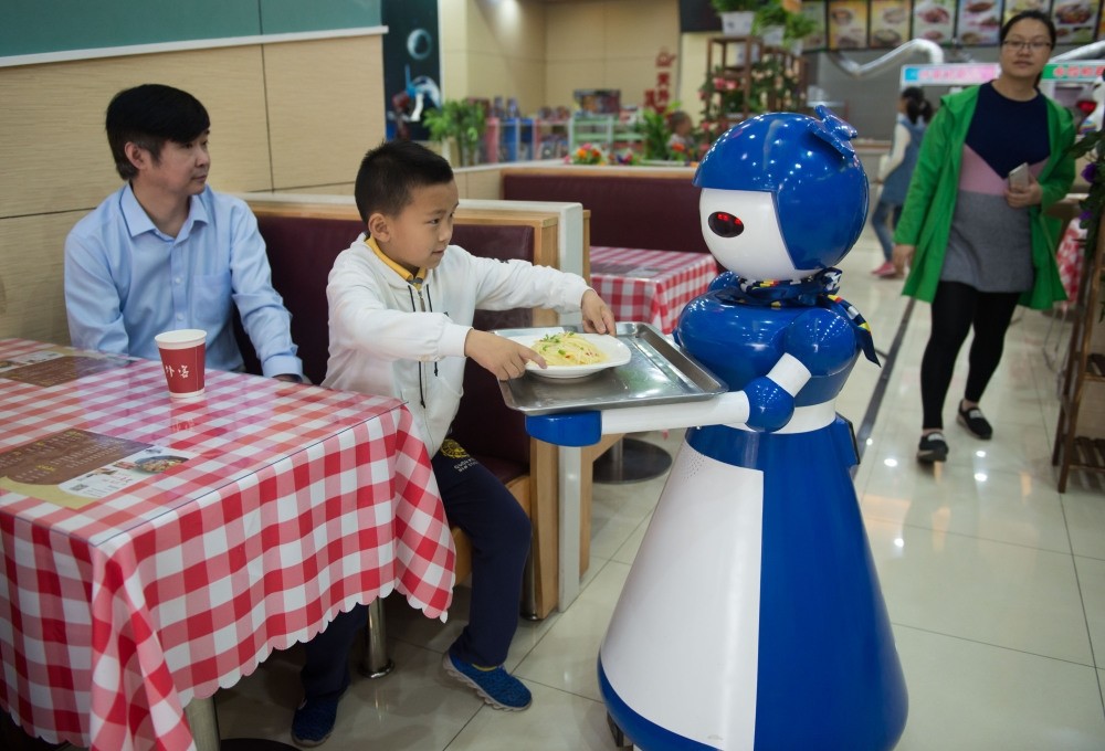 A new cafe in China is running its restaurant with  robots as employees. Located in Kunshan, eastern China, the restaurant relies on over a dozen machines for tasks such as greeting customers, waiting on tables and cooking basic meals.