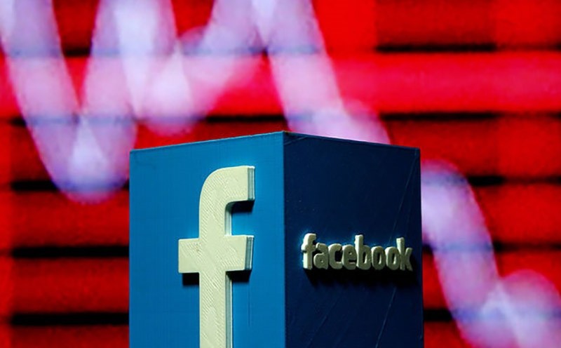 A 3D-printed Facebook logo is seen in front of a displayed stock graph in this illustration taken Nov. 3, 2016. (Reuters Photo)