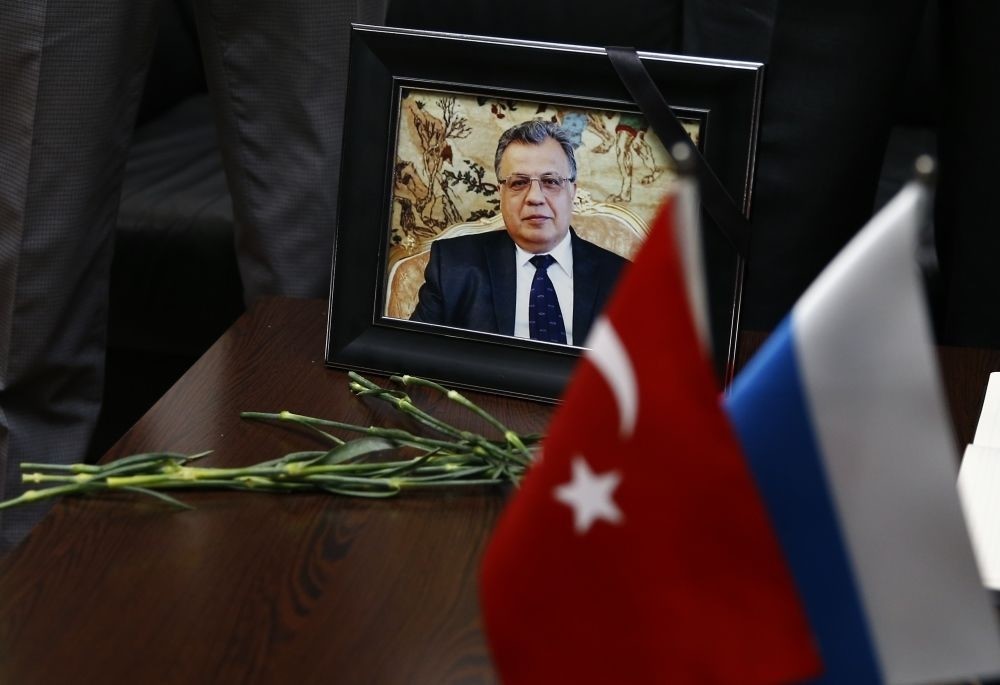 Photo of late Russian Ambassador to Ankara Andrey Karlov displayed with Russian and Turkish flag in Antalya on Dec. 20.