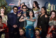 Indian actors Anil Kapoor (2ndL), Hrithik Roshan (3rdL) and Sonakshi Sinha (2ndR) pose with dancers before a press conference held to present the Bollywood Oscars in Madrid on March 14.
