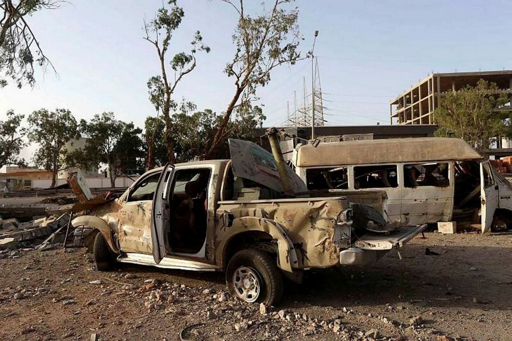 Destroyed vehicles were seen after fighting between rivals in the eastern city of Benghazi.