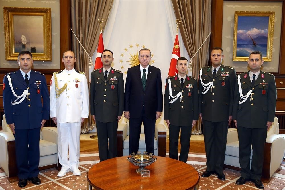 In this file photo, President Recep Tayyip Erdou011fan is pictured with his aides, including Erkan Ku0131vrak (on his left side)