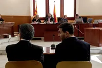 Barcelona's Argentine soccer player Lionel Messi (R) sits in court with his father Jorge Horacio Messi during their trial for tax fraud in Barcelona, Spain, June 2, 2016. (Reuters Photo)