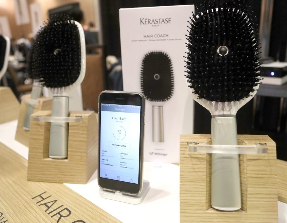 French-made Ku00e9rastase smart Hair Coach hairbrush with connectivity to smart phones is displayed at the 2017 International Consumer Electronics Show (CES) in Las Vegas.