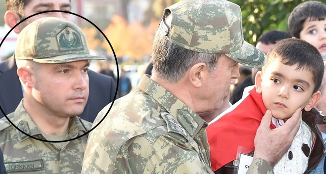 In this file photo, Lt. Cl. Levent Türkkan is pictured beside Turkey's Chief of Staff Hulusi Akar