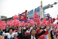In this May 10, 2016, file photo, parade participants march with a model of the Unha space launch vehicle at the Kim Il Sung Square on Tuesday, May 10, 2016, in Pyongyang, North Korea. (AP Photo)
