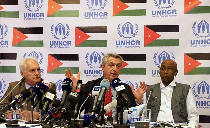 UN High Commissioner for Refugees, Filippo Grandi (C), flanked by UNHCR new representative to Jordan, Stefano Severe (L), and UNHCR Mideast and North Africa Bureau Director, Amin Awad, holds a press conference in Amman on Oct. 24, 2016. (AFP Photo)