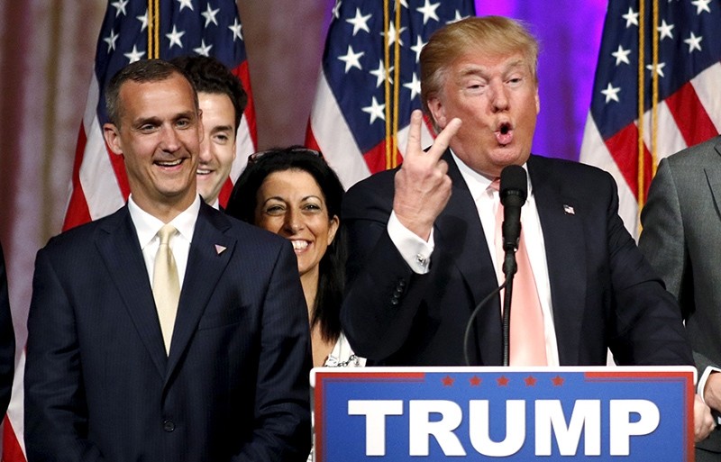 Republican U.S. presidential candidate Donald Trump's campaign manager Corey Lewandowski (L) looks on as Trump speaks (Reuters Photo
