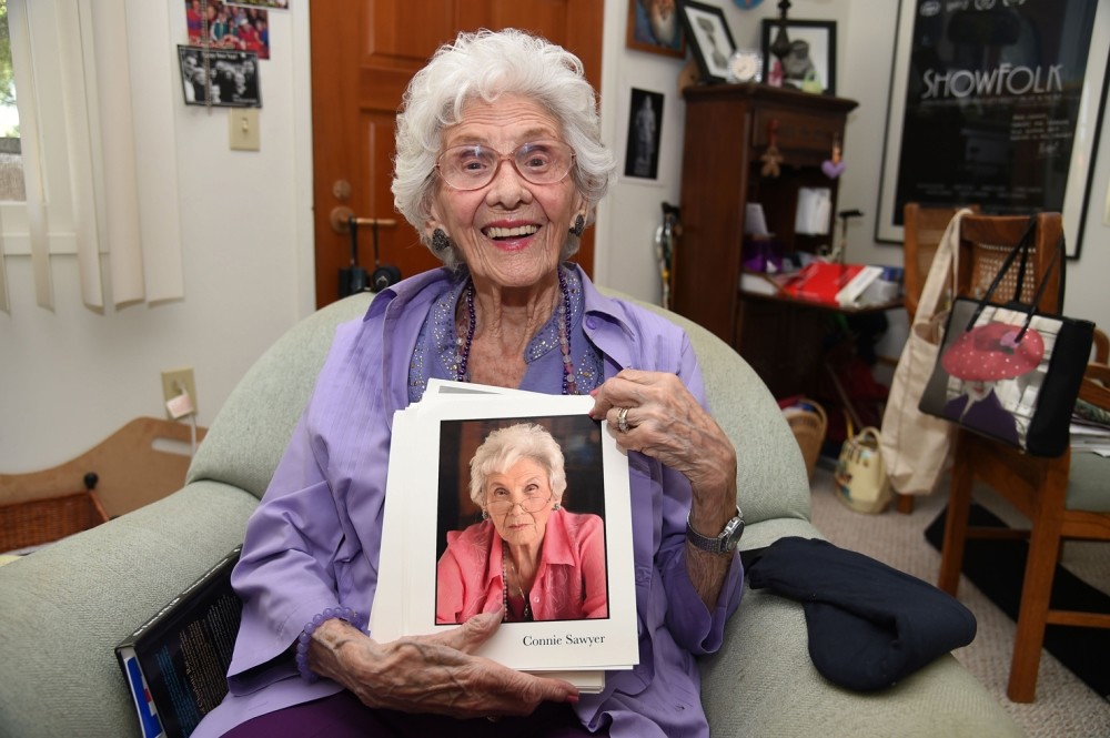 Working actress Connie Sawyer, 103, displays some of her headshots during an interview with AFP at her home in the retirement community of the Motion Picture Television Fund (MPTF).