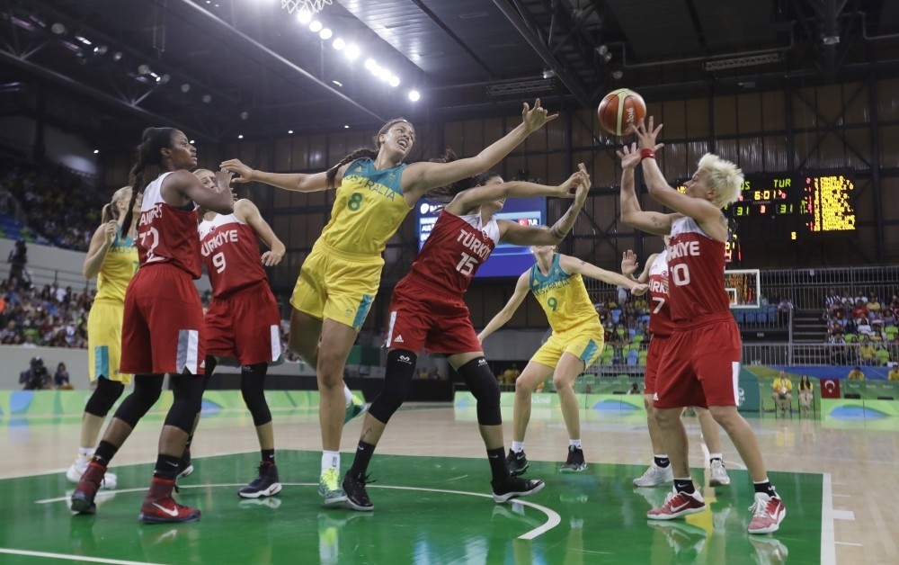 Australia center Liz Cambage (8), Turkey forward Tilbe u015eenyu00fcrek (15) and Iu015fu0131l Alben reach for the rebound during the second half of a women's basketball game at the Youth Center at the 2016 Summer Olympics in Rio de Janeiro.