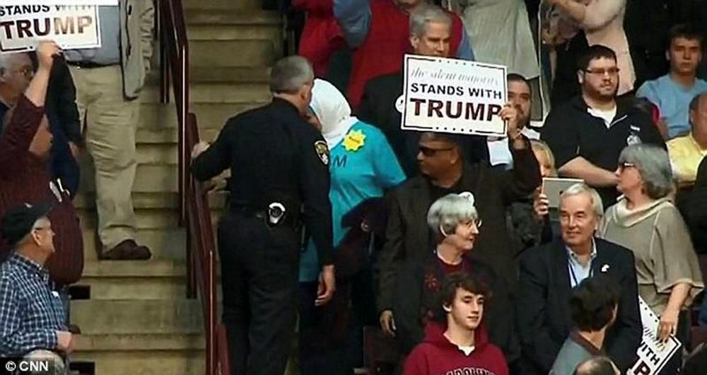 A Muslim-American woman whose T-shirt reads u2018I came for peace' was forced to exit during Trump's speech.