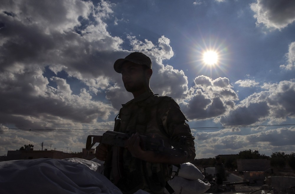 A member of the Turkey-backed Free Syrian Army (FSA). As Operation Euphrates Shield continues against DAESH, some groups withdrew from the operation in reaction to the U.S.'s support for the YPG, a threat to Syria's terrotorial integrity.