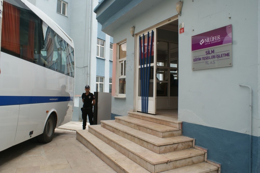A police officer stands outside a Gu00fclen-linked school after a raid in the western city of Bursa.