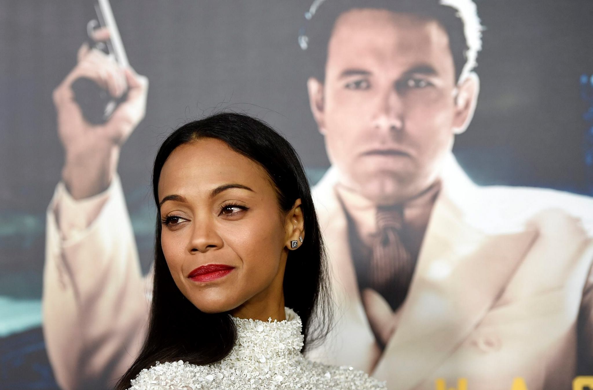 Zoe Saldana, a cast member in ,Live by Night,, poses at the premiere of the film at the TCL Chinese Theatre on Monday, Jan. 9, 2017 in Los Angeles. (AP Photo)