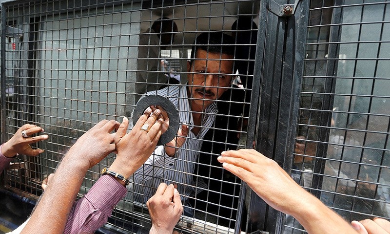 A convict in connection with a riot in Gujarat in 2002 is seen inside a police vehicle at a court after the sentencing in Ahmedabad, India June 17, 2016 (Reuters Photo)