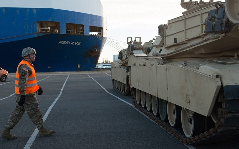 US soldier walks to a US Army tank in front of the cargo vessel 'Resolve' in Bremerhaven, northern Germany on Jan. 6, 2017. (EPA Photo)