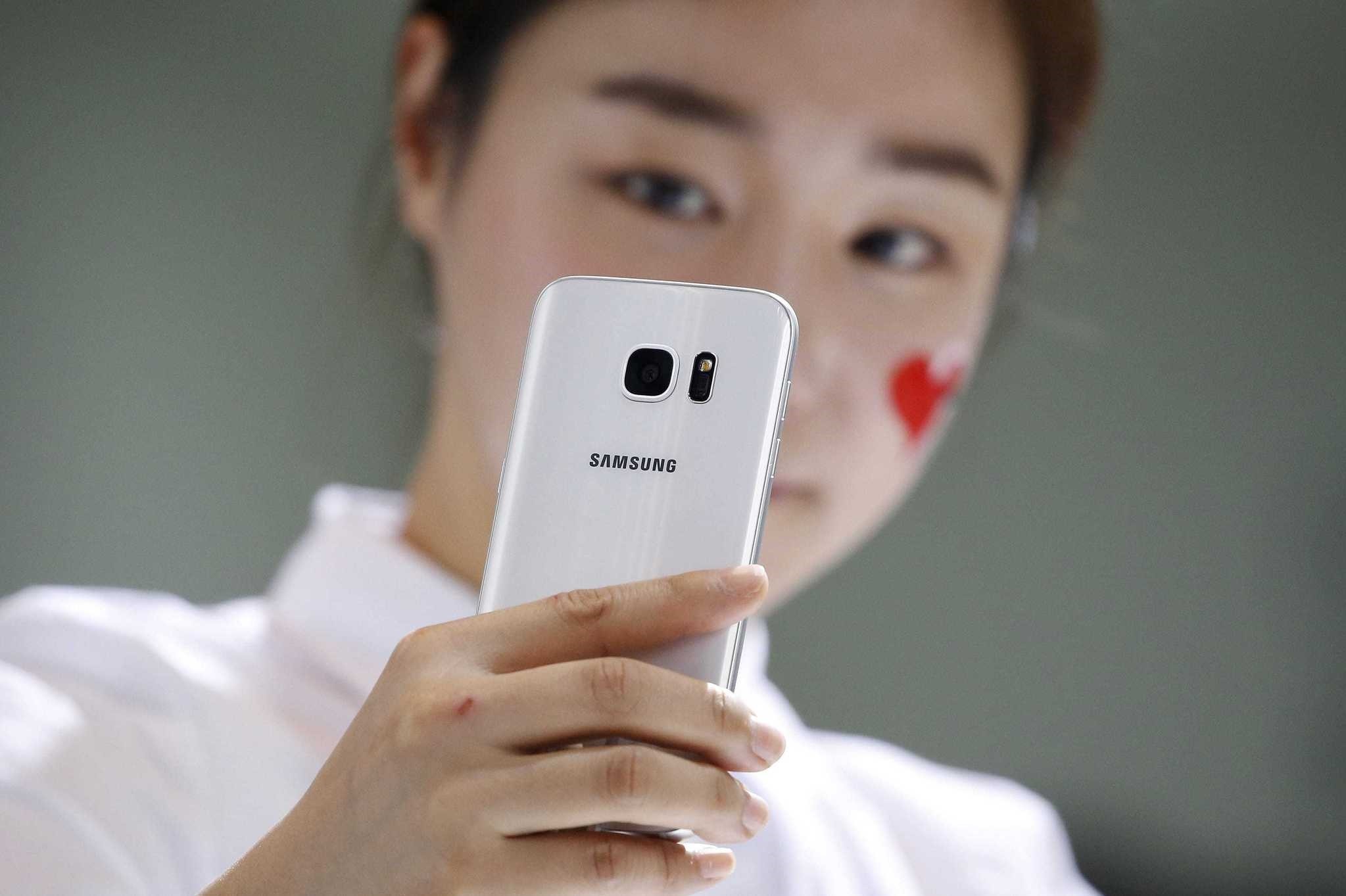 A model demonstrates Samsung Electronicsu2019 new smartphone Galaxy S7 during its launching ceremony in Seoul.