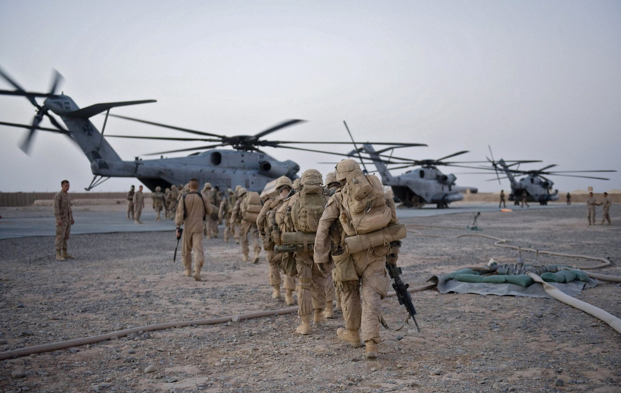 US Marines walk towards the helicopter as part of Operation Khanjar at Camp Dwyer in Helmand Province in Afghanistan on July 2, 2009. (AFP)